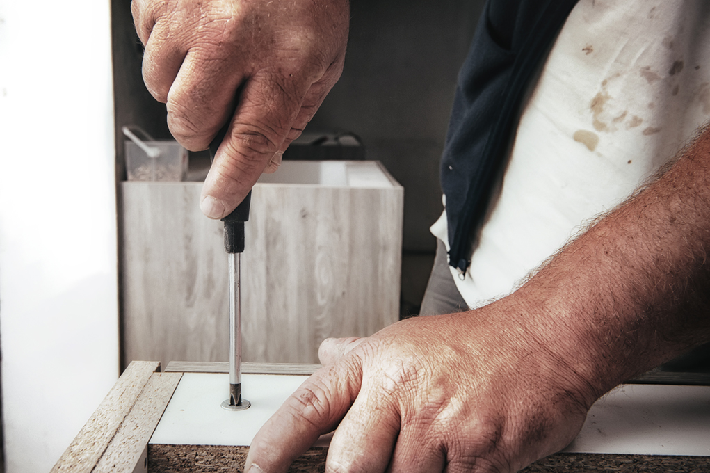 Pre-drilled steel cam and dowel to lock components together.